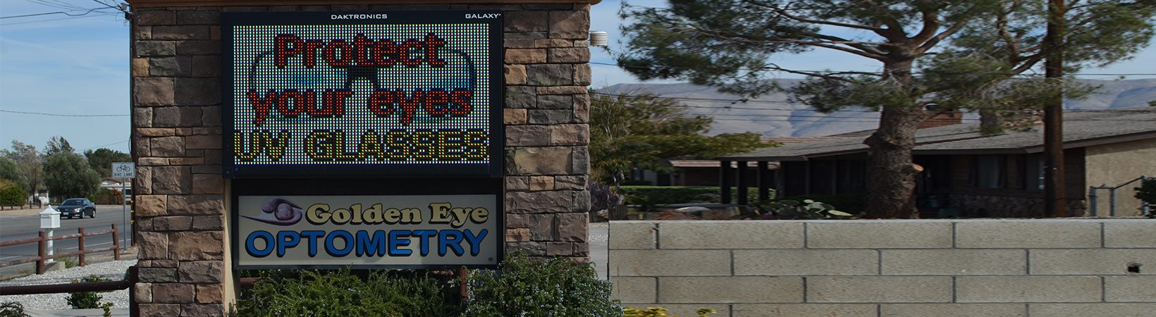Golden Eye Optometry Sign with protect your eyes text