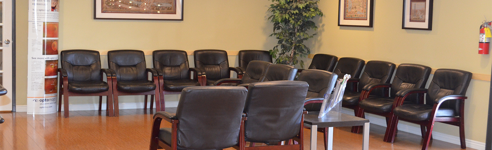 black leather padded chairs near beige wall