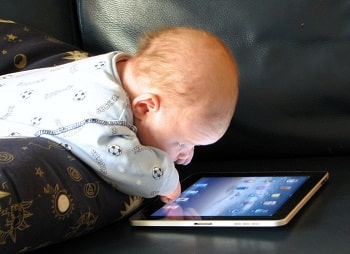 baby playing with iPad