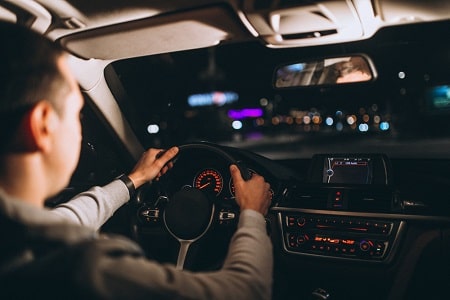 young man driving his car-night time